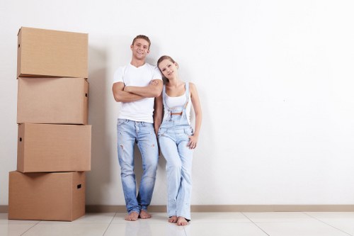 Worker beside stacked storage items for an Eltham pricing example