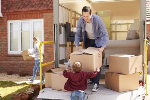 Organized storage space in Eltham with packed boxes and furniture