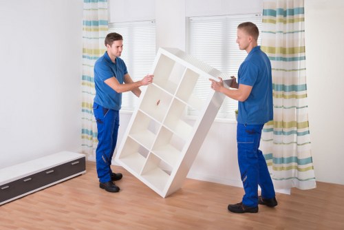 Removal team estimating a small apartment clearance in Eltham